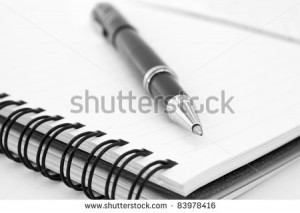 stock-photo-notebook-and-pen-in-composition-in-black-and-white-83978416